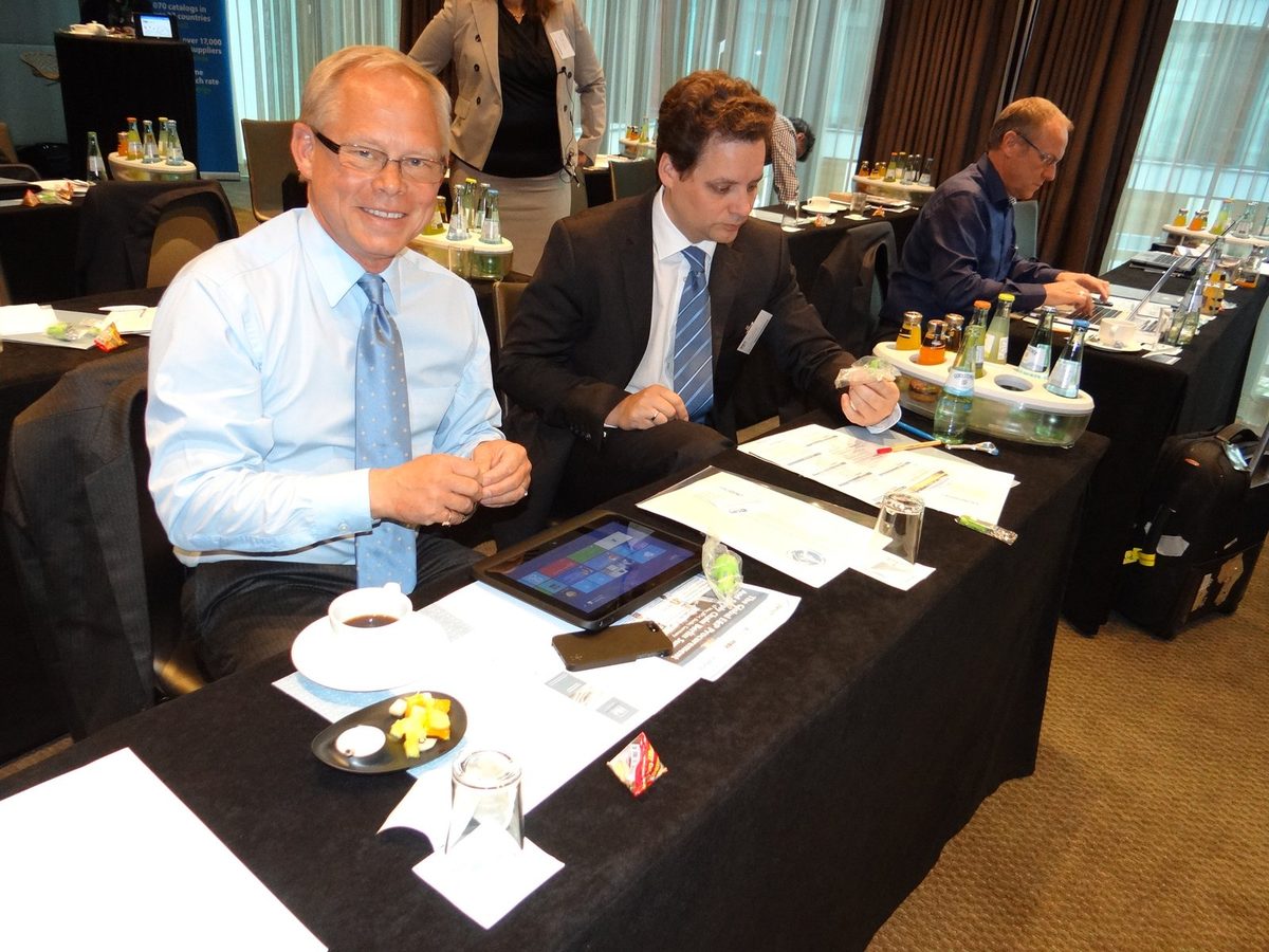 Delegates working at tables between sessions at a previous Zenith Group event